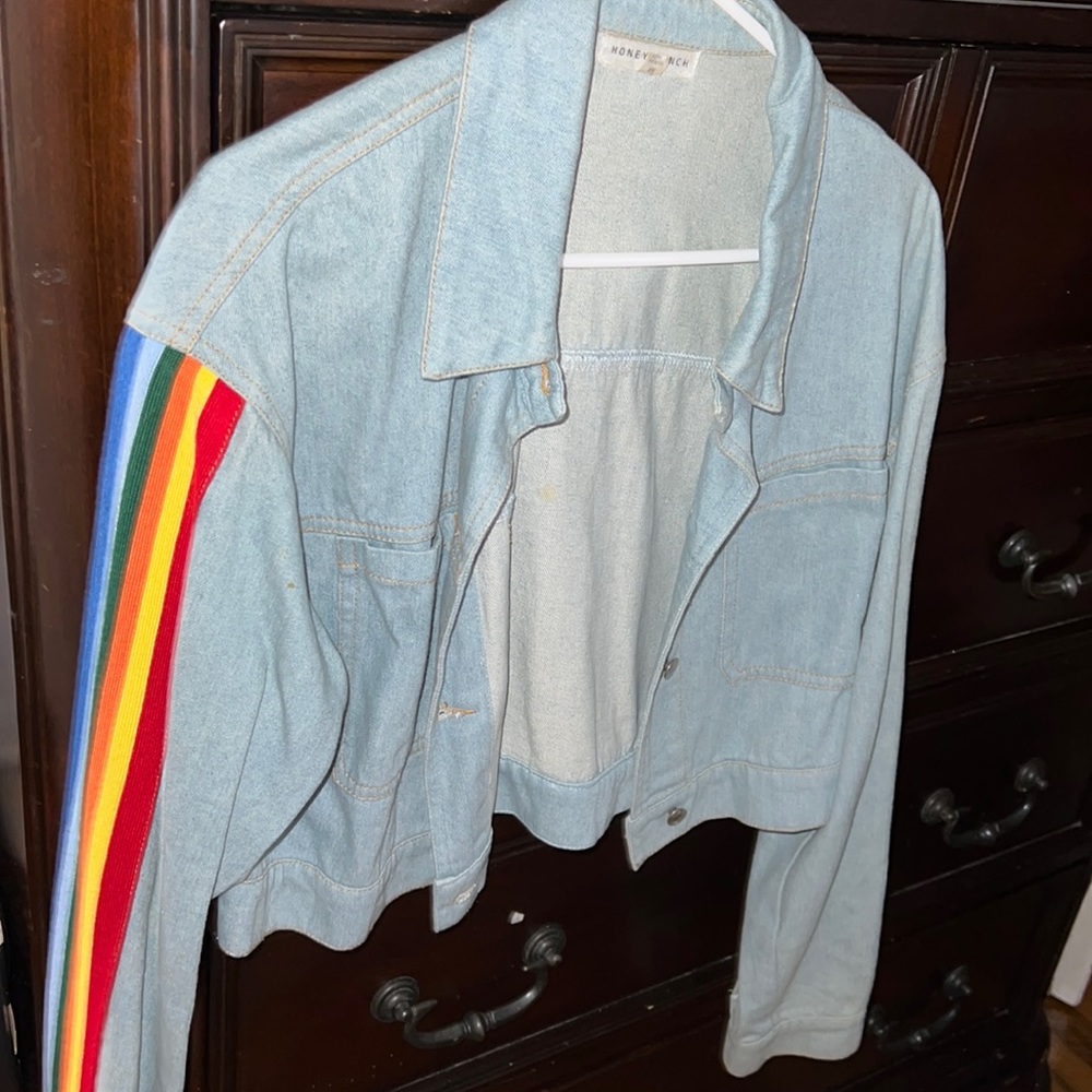cute cropped jeans jacket , with rainbow stripes on the arm.